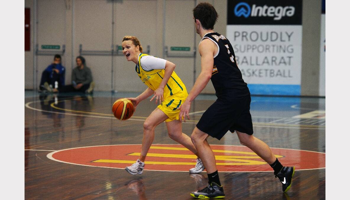Australian Opals practice game against the Miners Big V youth championships team. Opals- Jenni Screen and Miners Youth- Brady Neill. PICTURE: KATE HEALY.