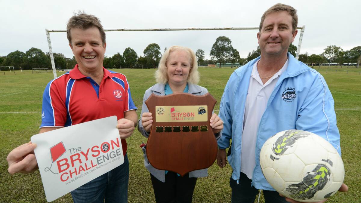 Lisa Ruprecht (centre) Bryson Challacombe's mum, holds the Bryson Challenge Shield, flanked by Old Bar president Warren Steedman (left) and his Taree Wildcats counterpart Mark Woodward. The clubs will play for the shield for the first time tomorrow in the game at Old Bar.