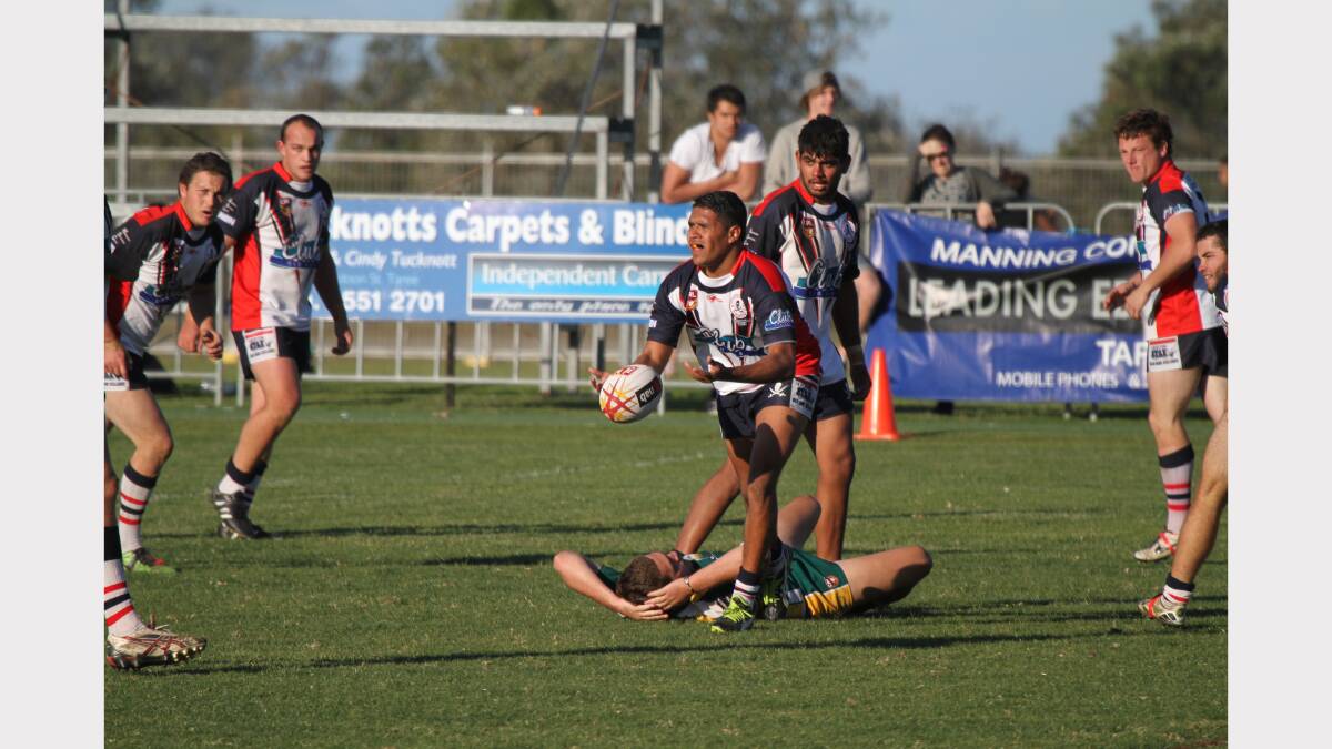 Pirates winger Aden Avery offloads the ball in last week's win over the Hawks.