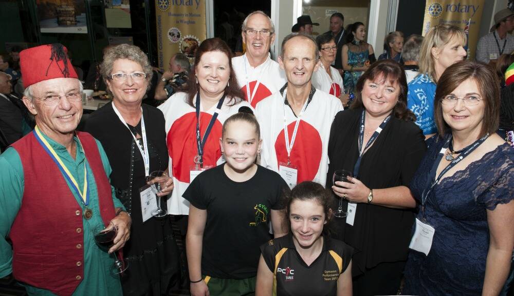International themed dinner: Geoff and Judy Fuller, Joy McCaffrey, David Fisher, Wayne and Meaghan Robbards and Marion O'Neill with Rhiaan Wheatley and Bree Parker from the Taree Gymaroos.