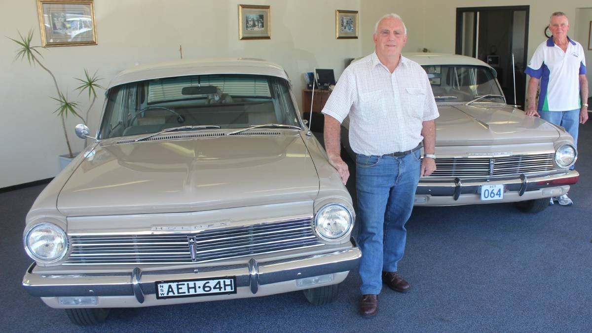GOULBURN: Goulburn men Dave Robertson (left) and Ken Fowler shared some good memories about the EH Holdens they owned and posed with Phil Robertson’s cars at his showrooms on Auburn St. The EH Holden celebrates its 50th anniversary in 2014.