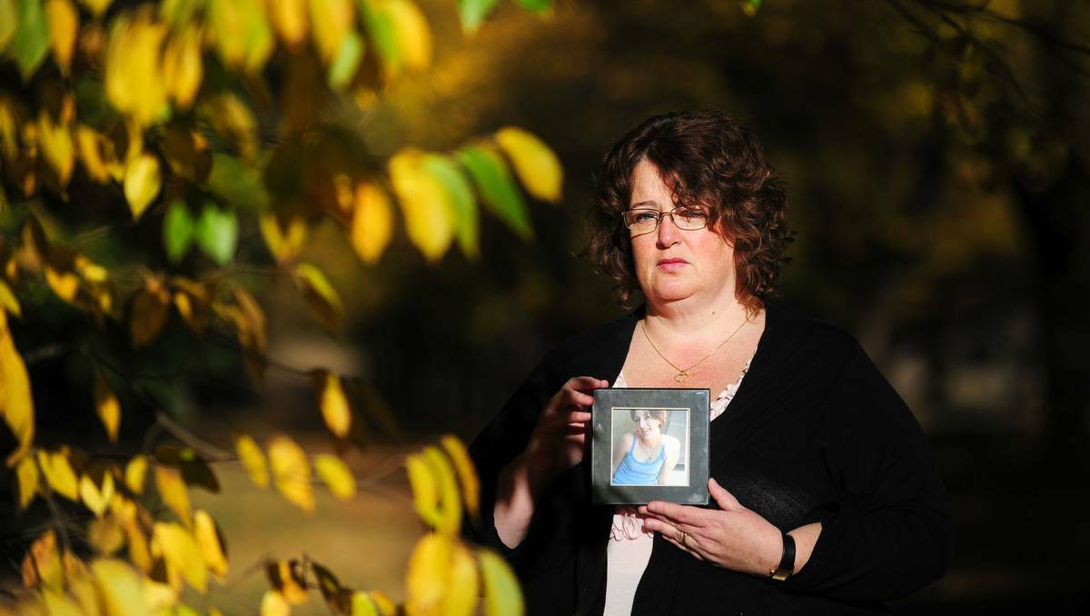 Beth Cassilles holding a picture of her missing daughter Laura Haworth. Photo: Katherine Griffiths