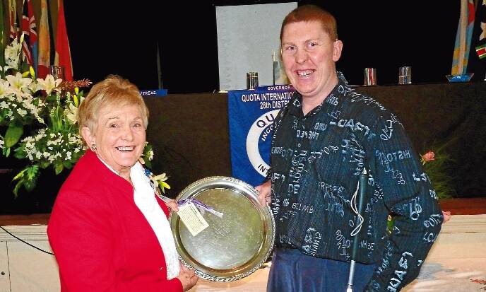 An inspiration: Quota district governor Jan Irvine presents Nate Quinell with his award.