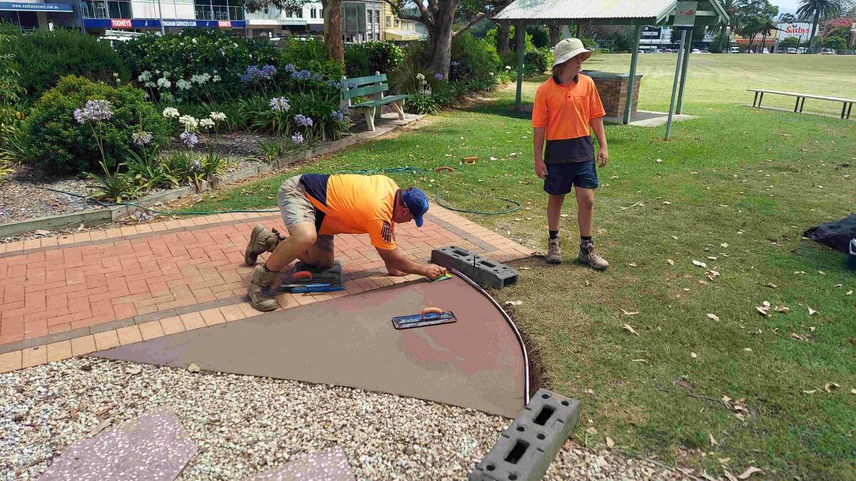 Personnel from Absolute Building Contractors finishing off the slab to be used for the statues donated by the Quota Club of Taree. Picture supplied.