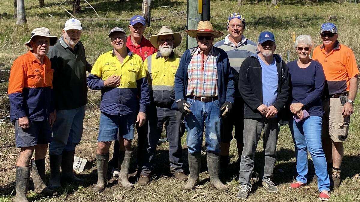 Hallidays Point Men's Shed and Lions Club members pitched in to construct a fence around the Black Head Road site for the new premises. Picture supplied