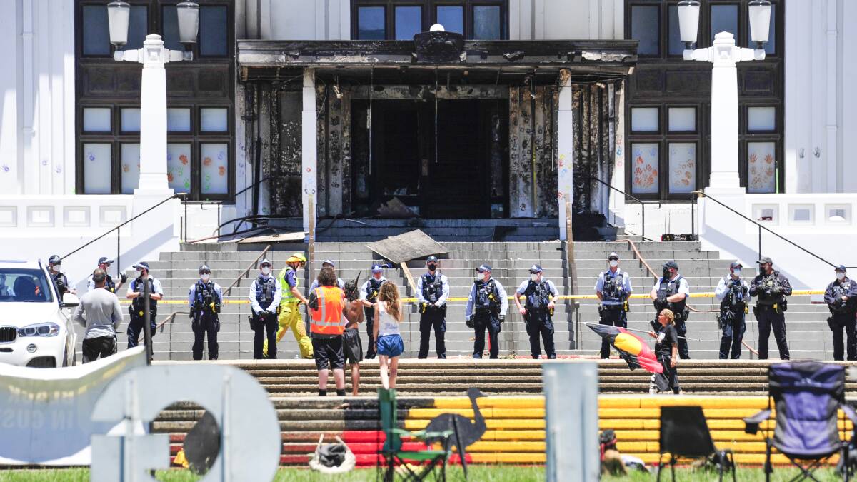 Police watch over Old Parliament House following the aftermath of the fire. Picture: Picture: Dion Georgopoulos