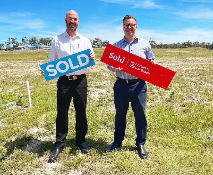 Adam Stevenson from Old Bar Beach LJ Hooker (right) with Michael Cameron from Lauders Real Estate at the Riverside Estate which sold 49 of the 51 blocks in a couple of hours earlier this month. Photo supplied. 