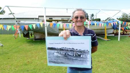 Cundletown and Lower Manning Historical Society vice president Bruce Gibson with 'Sunlight' and a photo of the boat in its glory days. Photo: Scott Calvin. 