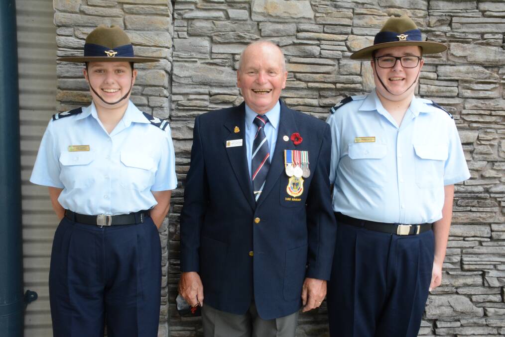 Cadet Sergeant's Lani Farrell and brother Mason with their grandfather Darcy Elbourne, Taree's RSL Sub-branch vice president. Photo Scott Calvin. 