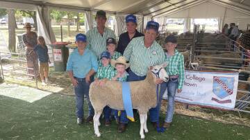 Finn, Tom, Boyd, Ivy, George, Bill, Ashley and Claire Corkhill, Normanhurst Border Leicester stud, Boorowa, with their supreme longwool ewe which was judged supreme exhibit of 2024 Royal Canberra Show,