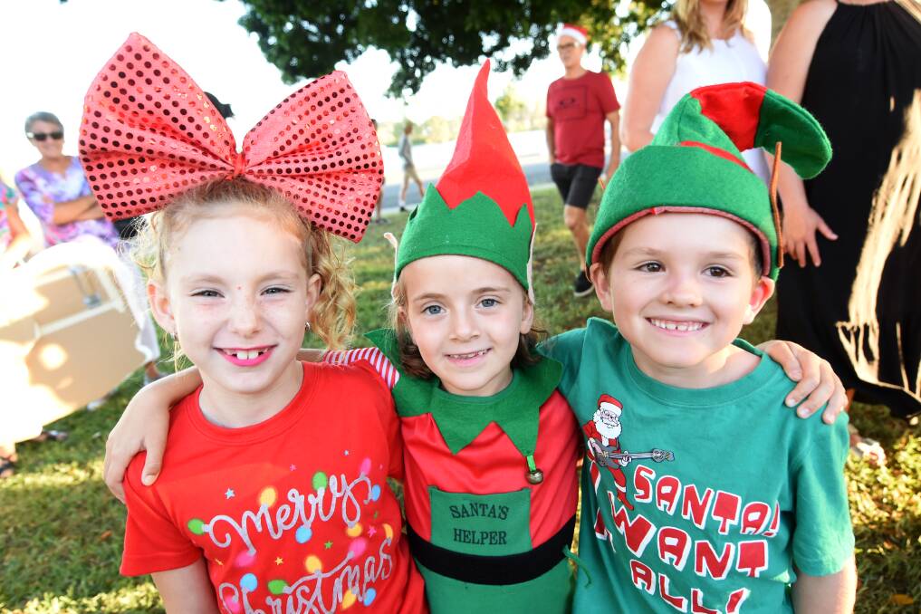Christmas spirit: Abby McKeough, Ivy Veale and Jacob Clark at the 2017 Carols in the Park in Taree. The community event is on again this Sunday, December 9. Photo: Scott Calvin.