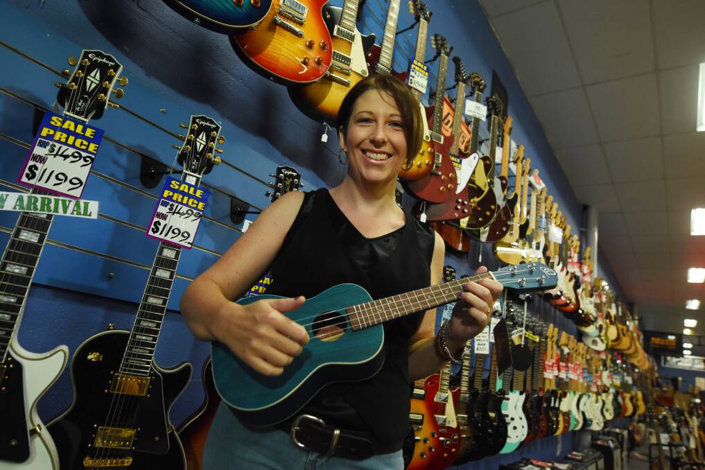 Musical boom: Tanya Brown from Bass'n'Blues in Taree said people have been coming in to the store to buy musical instruments as they go into lockdown and social isolation. Photo: Scott Calvin.