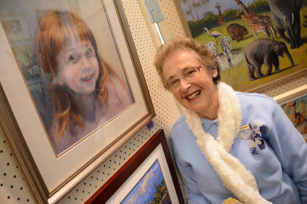 Time to put work forward: Beryl Moriarty with one of her entries in last year's Taree Open Art Exhibition. Entries are now open for this year's competition.