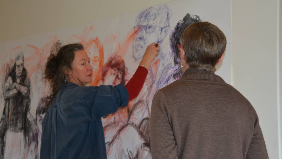 Jo Ernst draws a portrait at the Manning Regional Art Gallery.