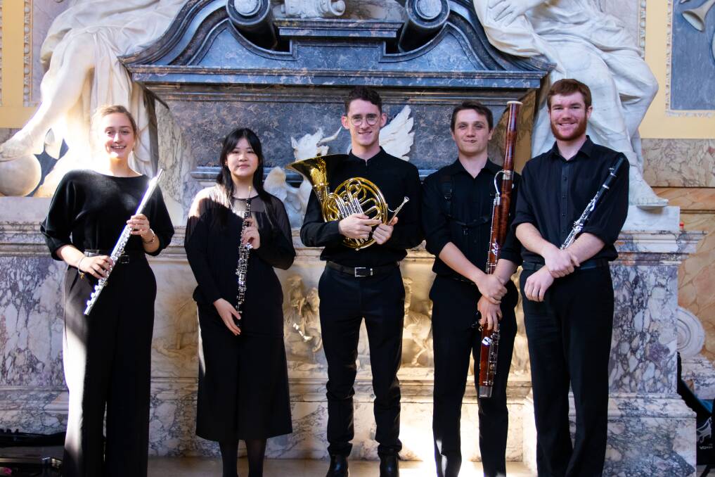 Joshua Reynolds from Taree, pictured second from the right, holding the bassoon is part of this Thursday's The Big Busk in Sydney.