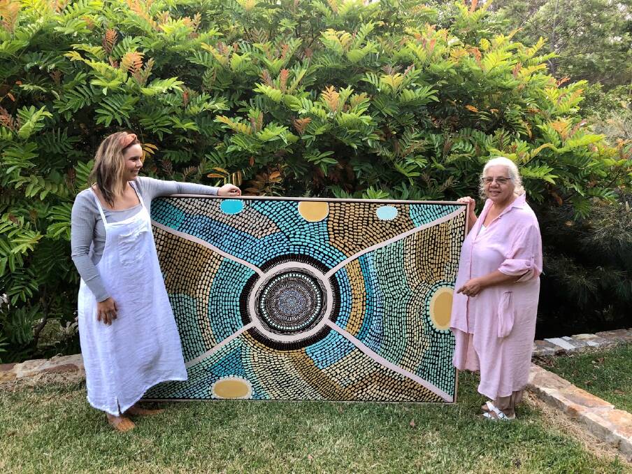 Artists: Melissa Greenwood and Lauren Jarrett from Miimi & Jiinda, with the stunning artwork that has helped raise funds for local brigades of the RFS. Photo: Nine.