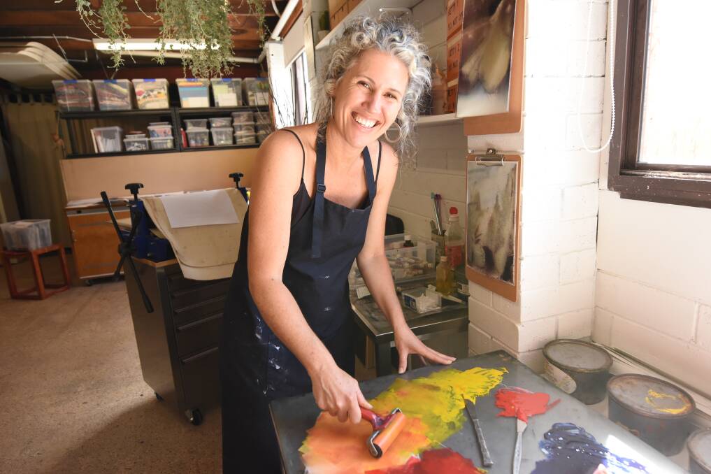 At work: Ali Haigh works with her hand roller to play with colour. Photos: Scott Calvin.