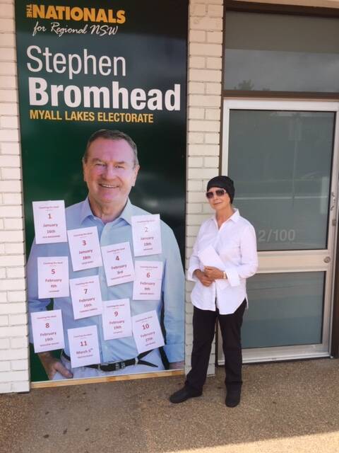 Leonie McGuire stands at Stephen Bromhead's Taree office at Valley Fair, where the street theatre took place.