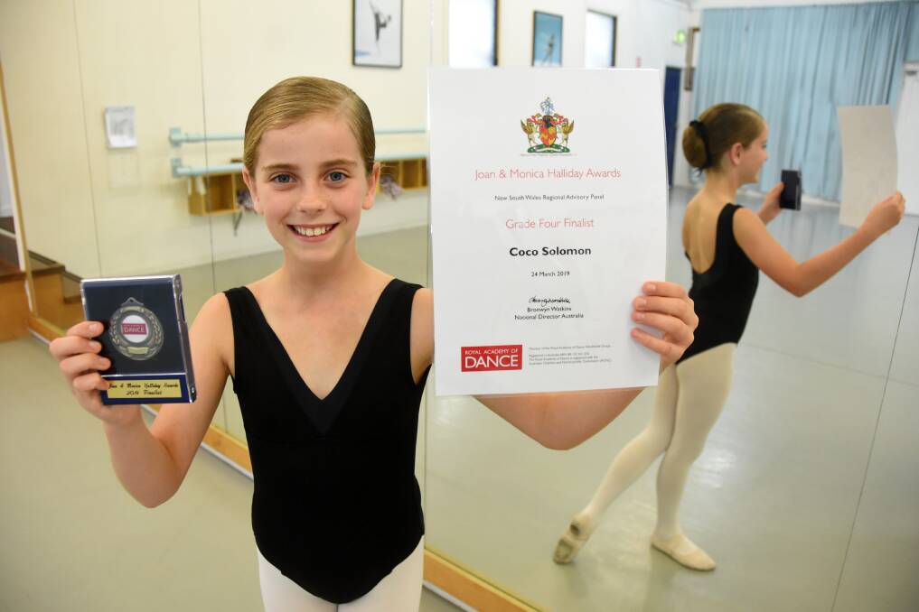 Recognised: Coco Solomon with the medal and certificate she received for being a grade four finalist in the Royal Academy of Dance's Joan and Monica Halliday Awards. Photo: Scott Calvin.