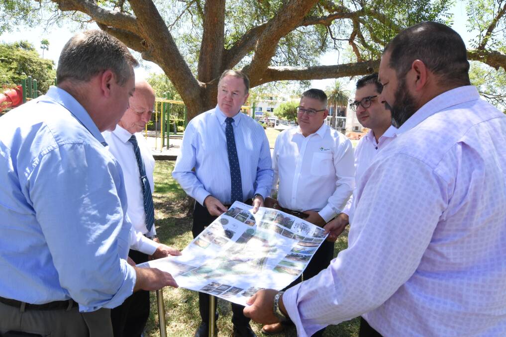 Looking over the plans: Minister for Planning Anthony Roberts, MidCoast Council mayor David West, member for Myall Lakes Stephen Bromhead, MidCoast Council's Director Community Spaces and Services Paul De Szell, council general manager Adrian Panuccio and council's Manager Community Spaces Daniel Aldridge. Photo: Scott Calvin.