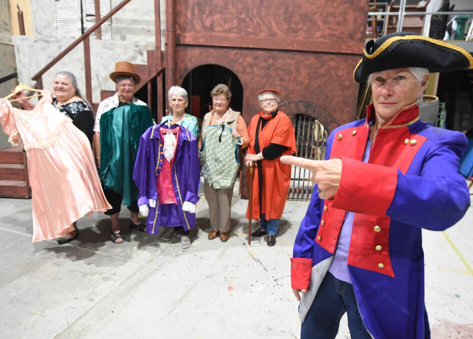 The look: Jill Illidge (foreground) with Mary Pertzel, Diana Gilbert, Jan Wood, Maureen Mears and costume co-ordinator Lea Young with some of the Les Misérables costumes. Photo: Scott Calvin.