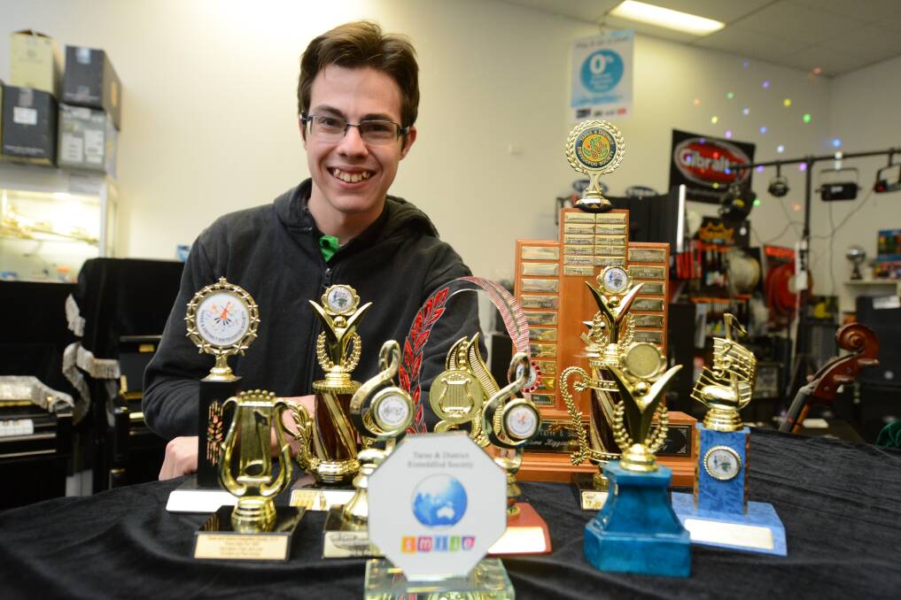 Trophy haul: Mitchell Brown was honoured to receive the Roma Liggins Perpetual Scholarship at this year's Taree and District Eisteddfod grand concert. Photo: Scott Calvin.