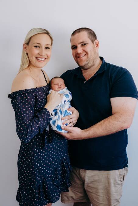 New arrival: Sandy and Macdaniel Nixon with their son, Hugh Anthony. Photo by Suzy George.