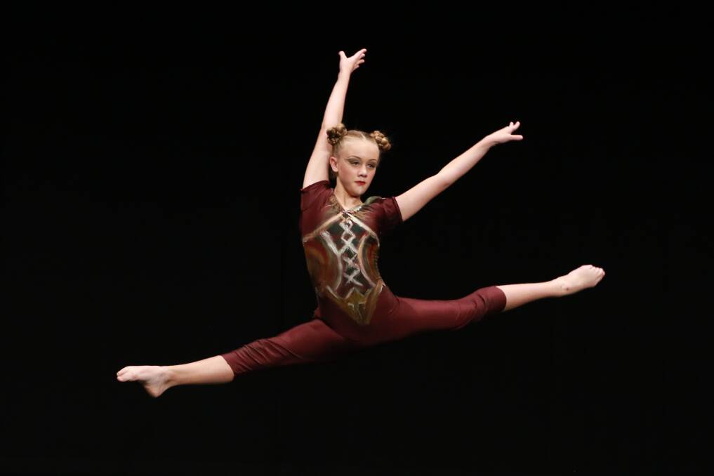 Flying leap: Maya Whittaker from Newcastle was the winner of Section 624a Open – Contemporary Solo 12 years and under. Photo: Scott Calvin/Carl Muxlow.