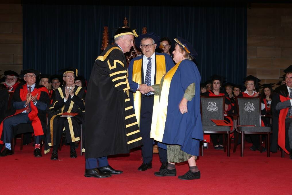 Proud moment: University of Sydney Vice-Chancellor and Principal, Dr Michael Spence, presents Joy Lambert with her Honorary Fellowship, while Barry Lambert looks on.