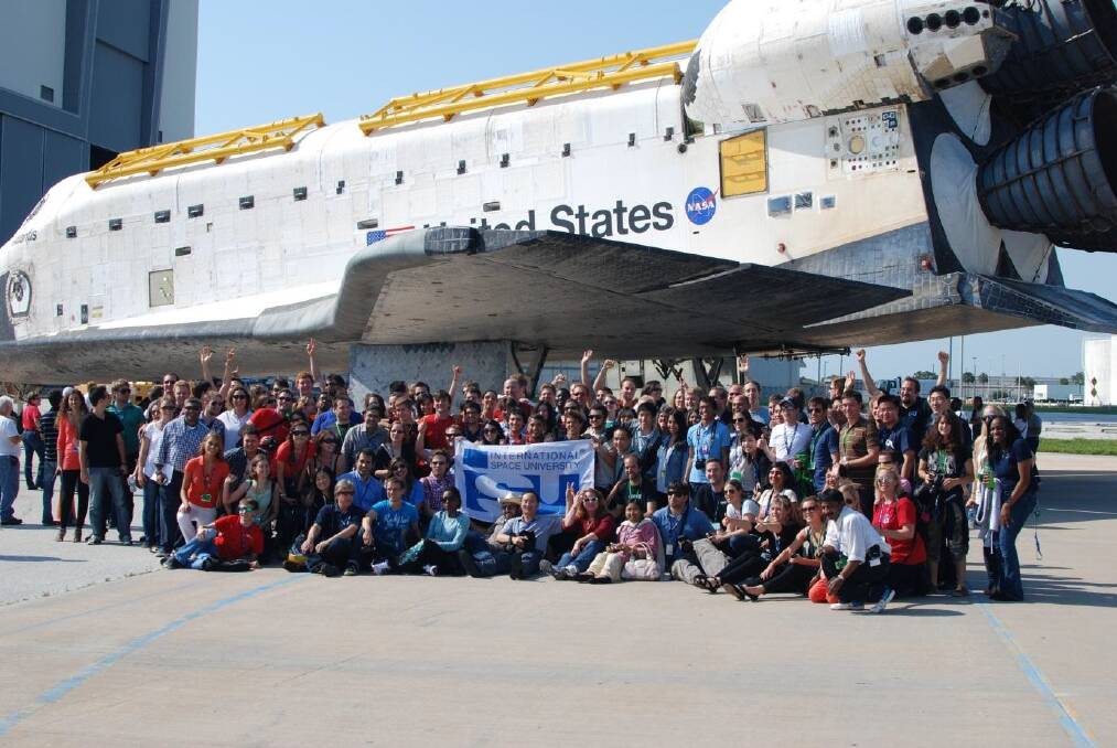 Exciting career: The space studies program participants under space shuttle Atlantis at NASA Kennedy Space Center (Kim Ellis is in a red shirt near the front, right).