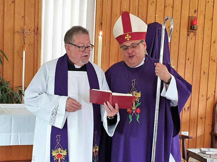 Fr Peter Tinney with Bishop Charlie Murry at Old Bar during Sunday's service.