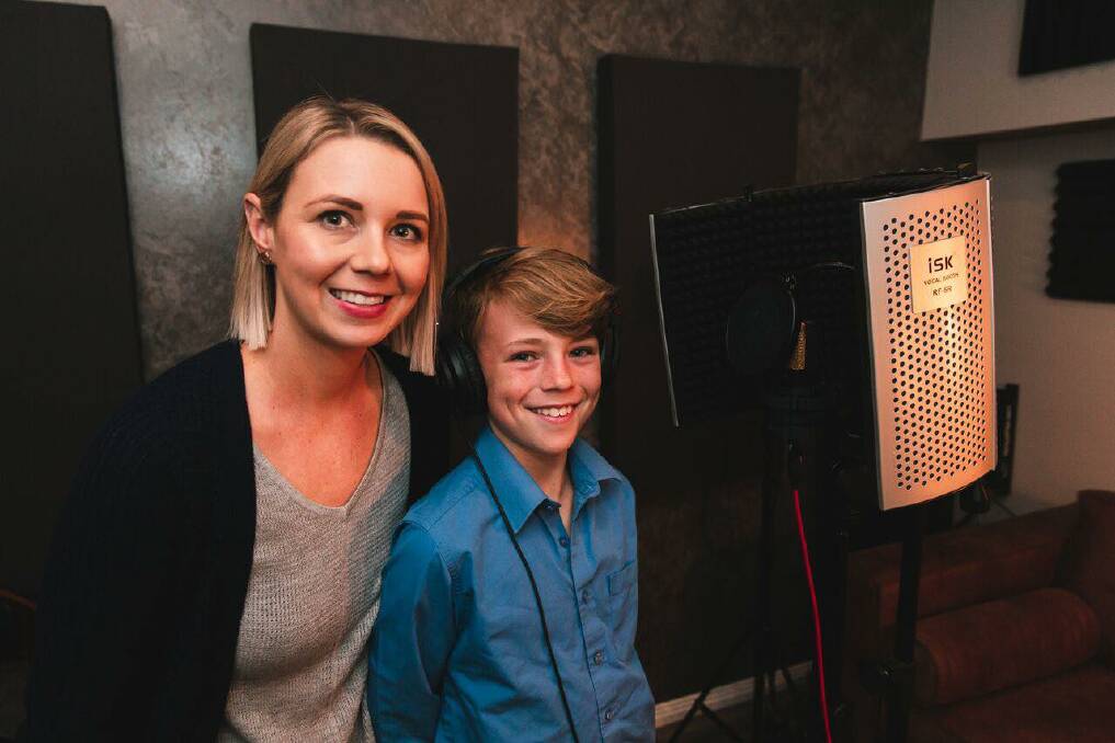 Hit record: Sam Stephens, pictured with his mum Leaha, at the Jake Davey Studios during the recording of his song, Nanna Jean.