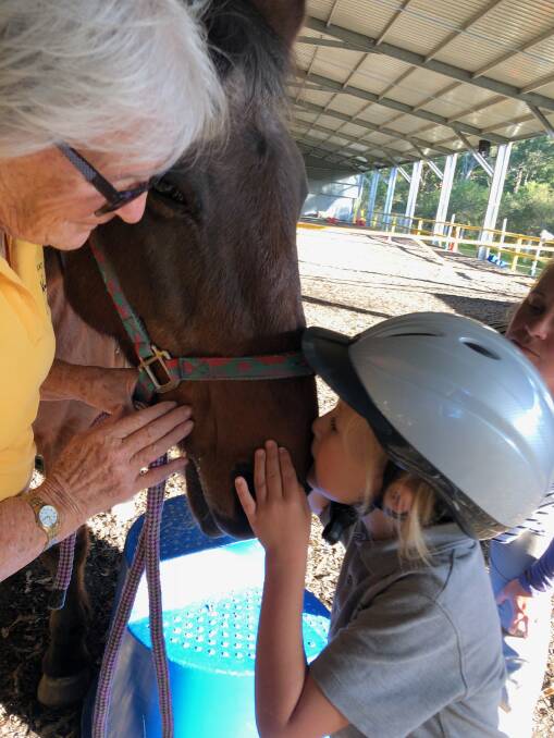 George Mortlock and a moment of affection with his first RDA horse Cinnamon and his coach Maureen Turner.