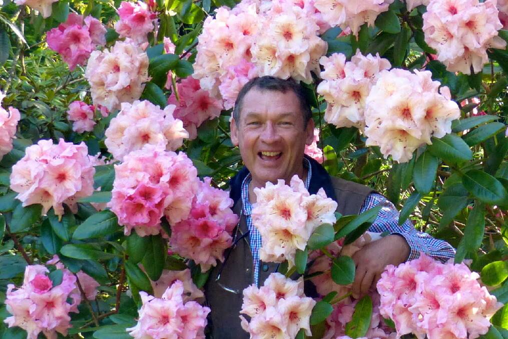 Sharing his passion: George Hoad has been writing his gardening column for the Wingham Chronicle for the past decade. Here he is pictured revelling in the beauty of an English garden in 2015.
