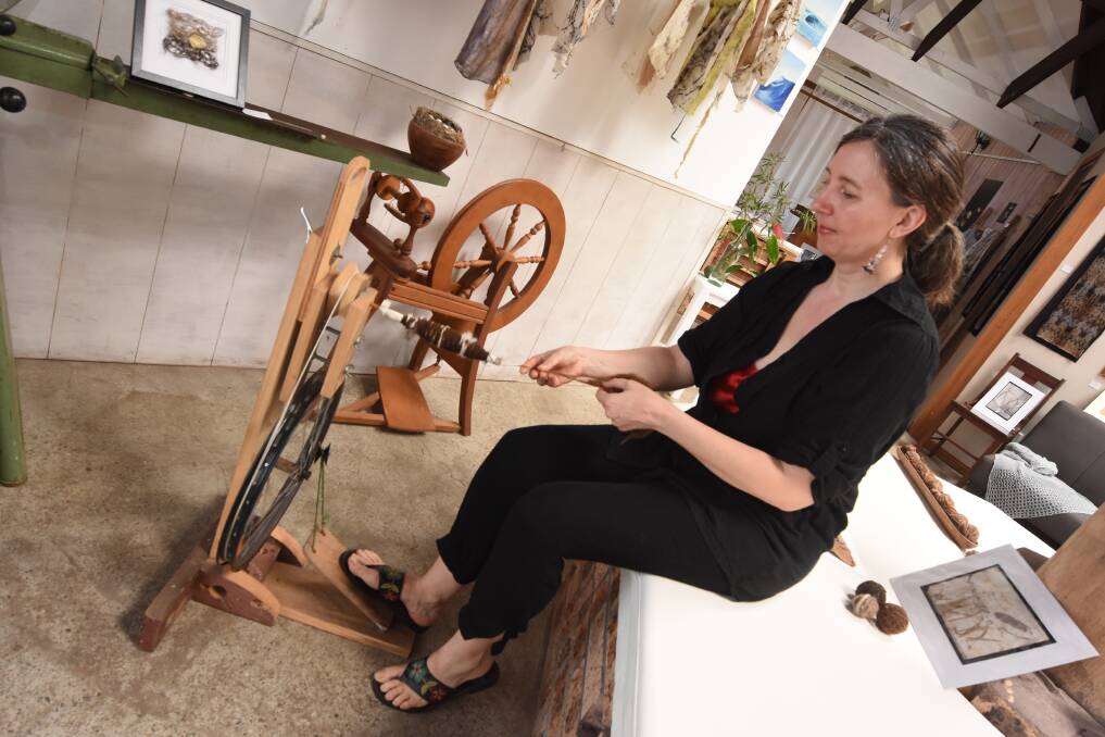 Handmade: Jana Pearceova works at the spinning wheel made by her husband Gerard from recycled materials and found objects.