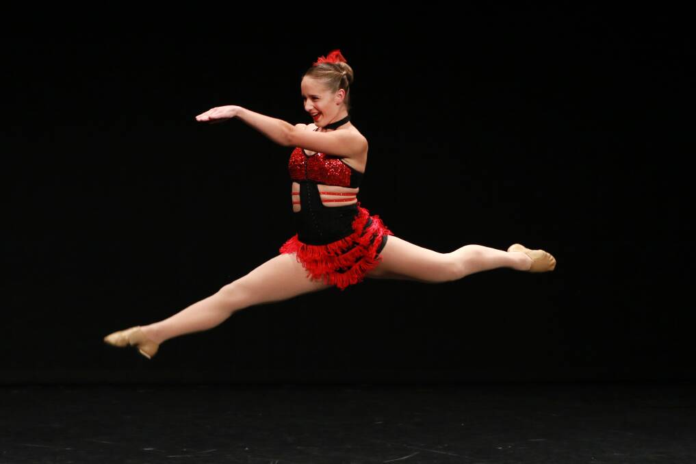 Flying leap: Kalani Cross from Taree was the winner of Section 538 District – Senior Jazz Championship 23 years and under. Photo: Scott Calvin/Carl Muxlow.