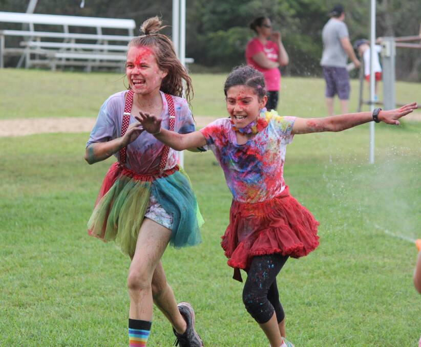 Messy fun: Marley Brown and Nina Davy during the fun run. Photo courtesy Old Bar Public School.