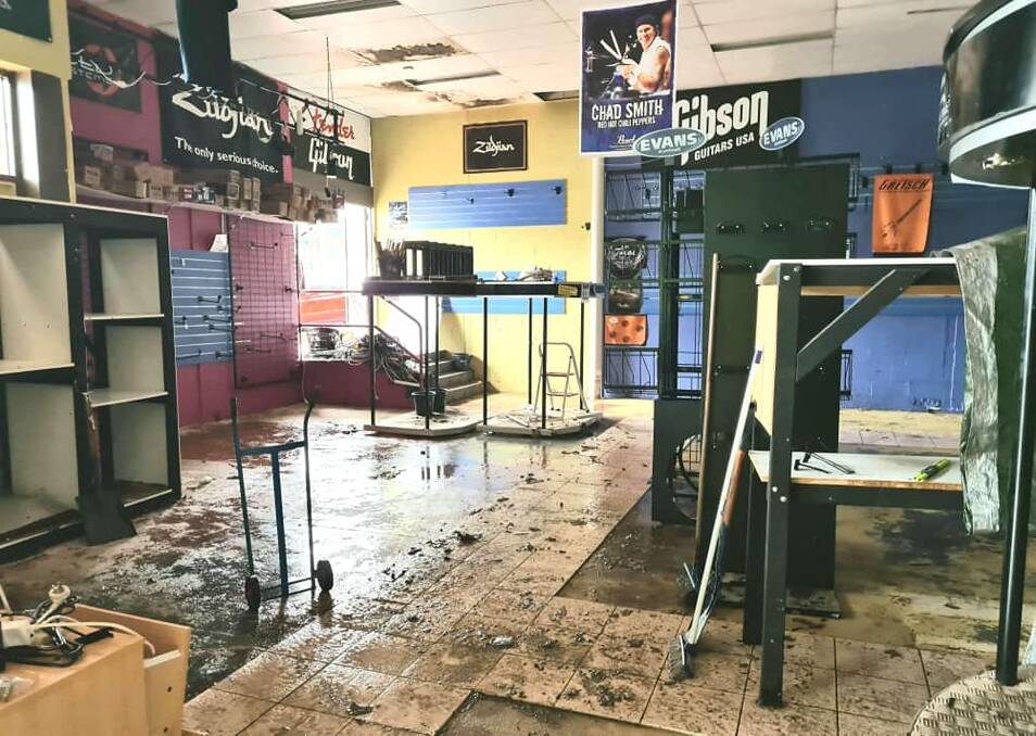 Clean-up: Bass'n'Blues Music Megastore clear of stock after the shop filled with water. Photo by Shell Brown.