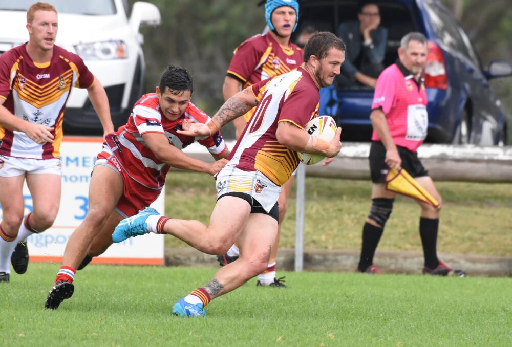 Group Three captain Shannon Ellem breaks a tackle during the clash against Group Two last season at Wingham.