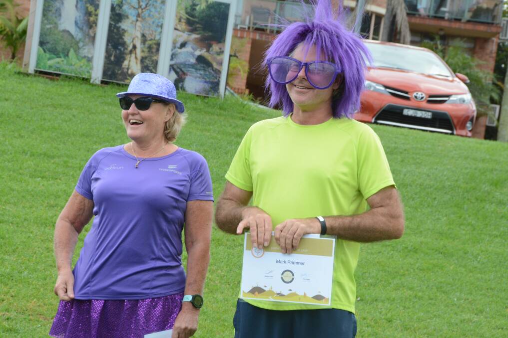Parkrunner of the year Mark Primmer with run director Margie Lewis. Purple was the theme for the second anniversary and Mark did his best to get into the spirit of the occasion.