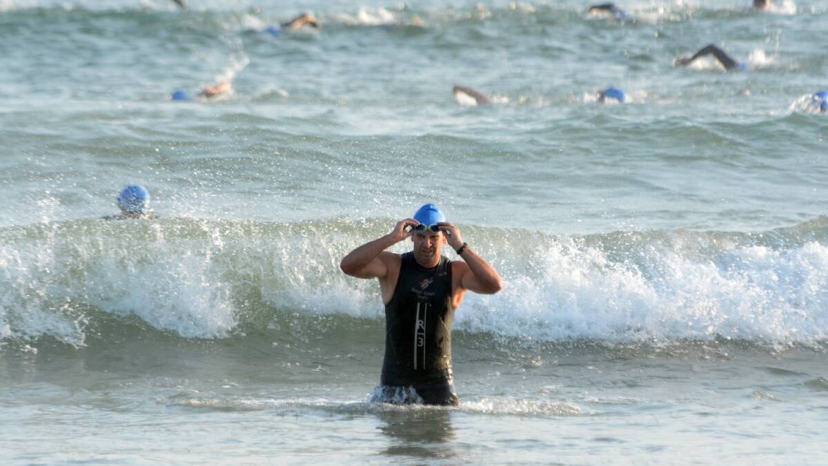 Triathletes head out of the surf at the conclusion of the 500m swim at last January's Crowdy Bay Triathlon.