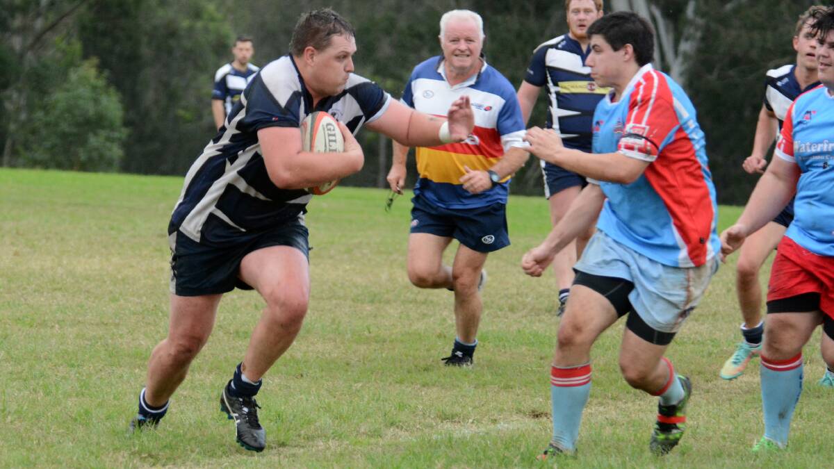 Manning Ratz captain Dave Rees looks to brush off an attempt of tackle during the clash against Old Bar at Taree Rugby Park. Rees turned in an inspirational effort as the Ratz prevailed 55-3.