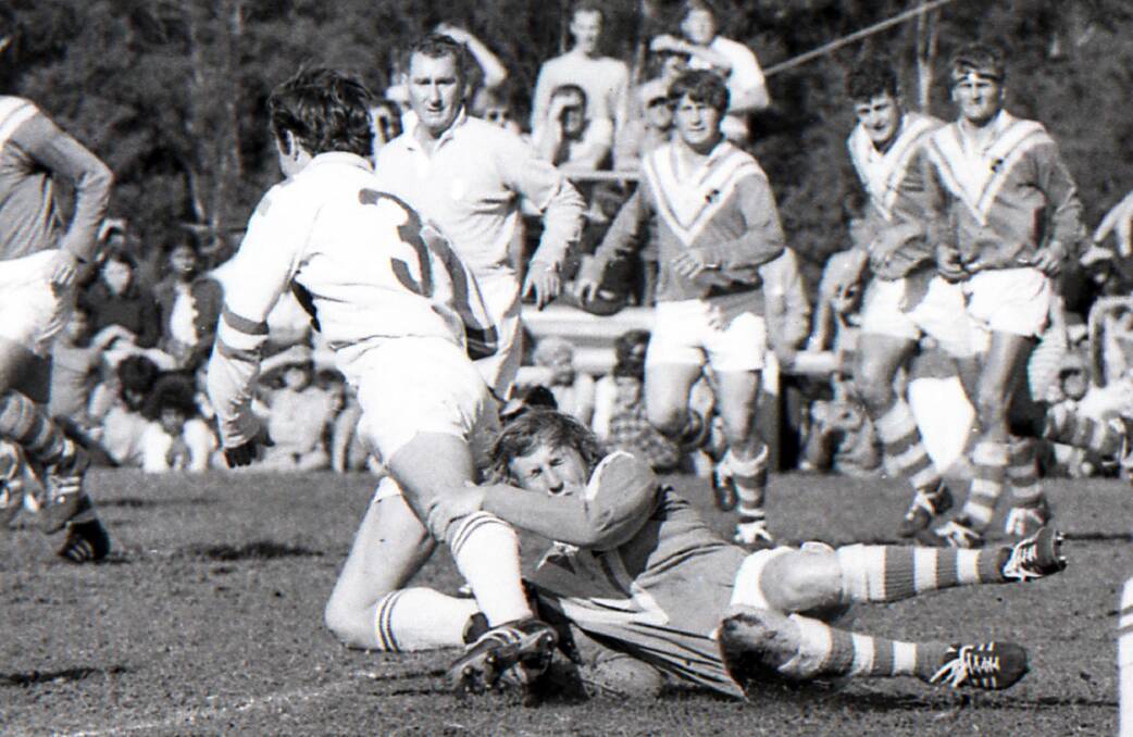John Adamson is grassed by Taree United's Harold Henry during the 1971 grand final. He represented Country Seconds earlier that season.
