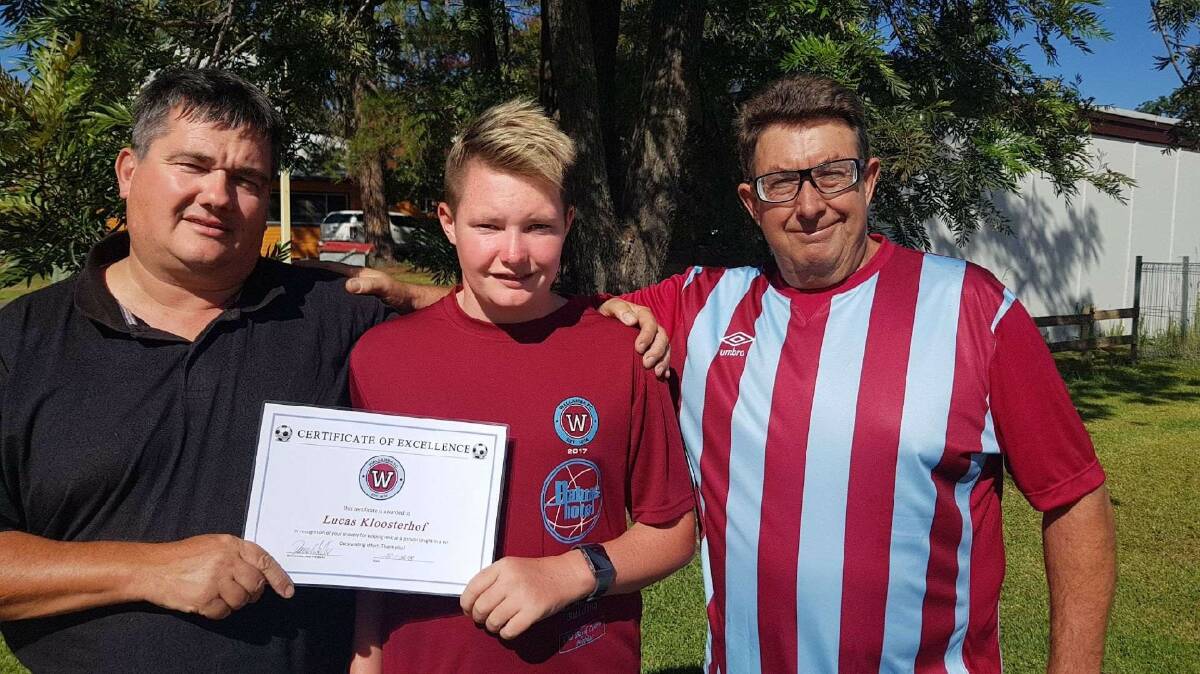 Lucas Kloosterhoff flanked by his dad Jonas and Wallamba Football Club president Dave Weller.