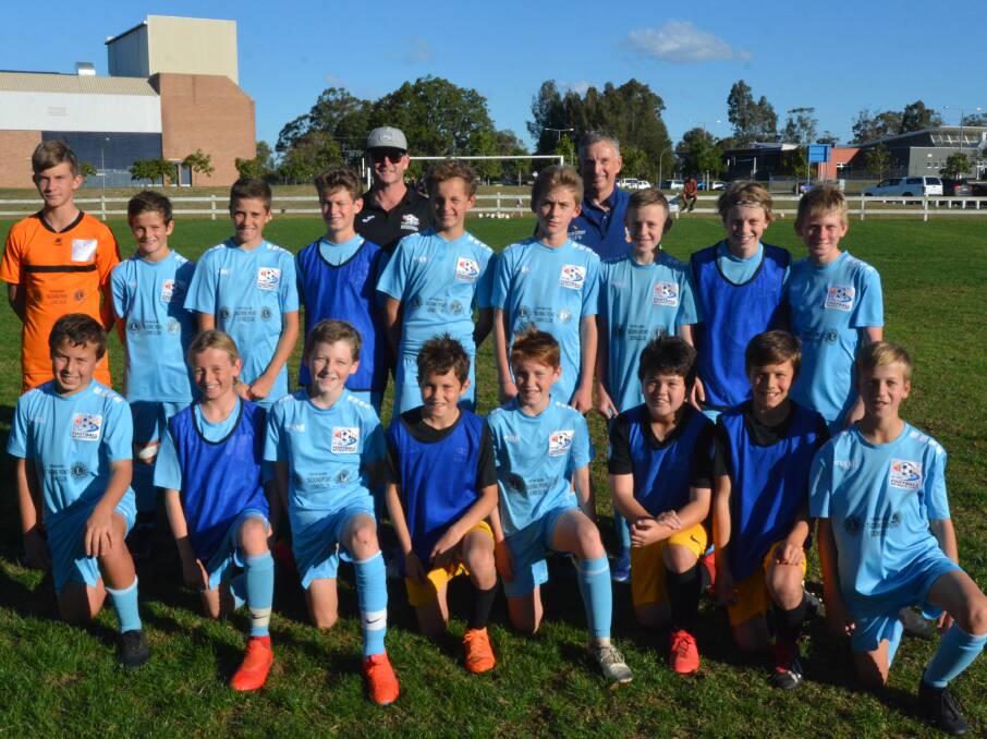 Ernie Merrick with the Football Mid North Coast under 13s after the training session at Tare Zone Field.