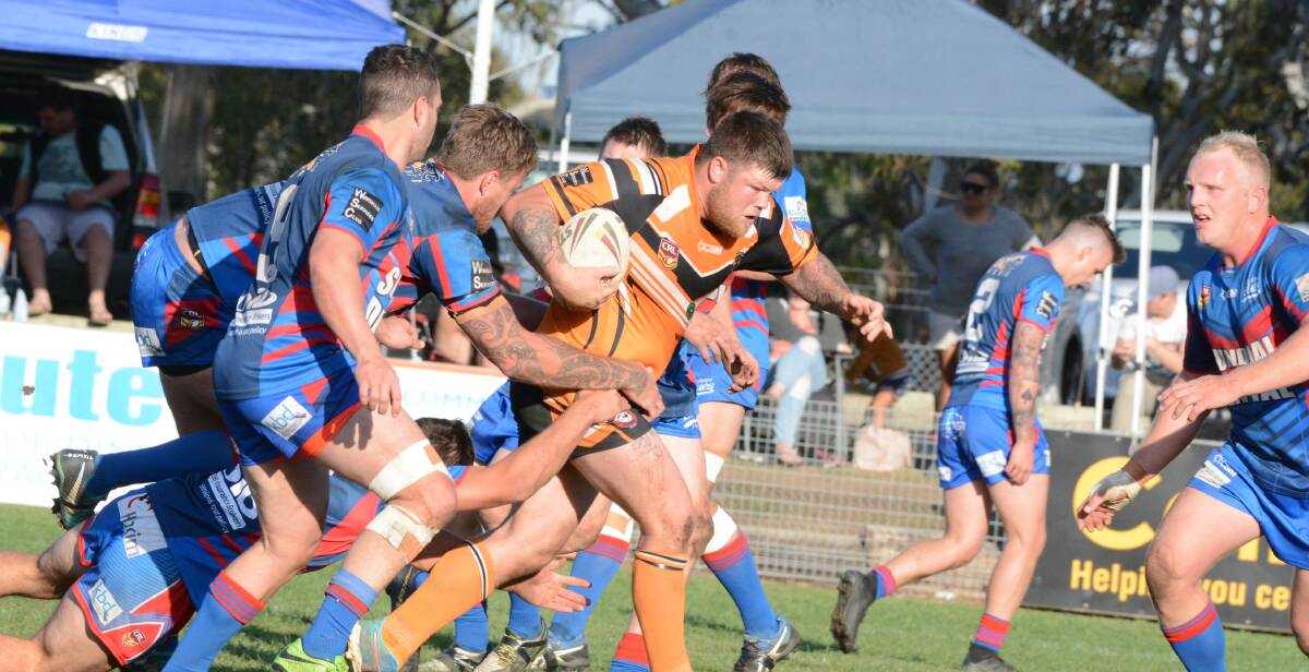 Wingham prop Nick Beacham makes one of his many charges into the Wauchope defensive line in the preliminary semi-final.