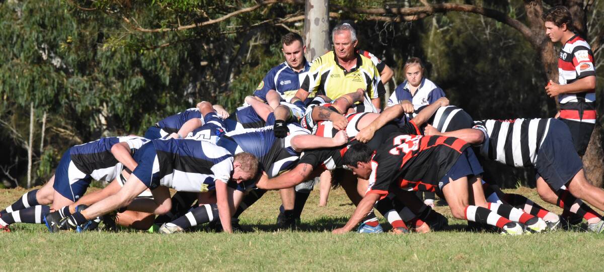 Gloucester and Manning Ratz pack down a scrum in the 2018 rugby season. The Cockies hope to return to the men's comp next year.