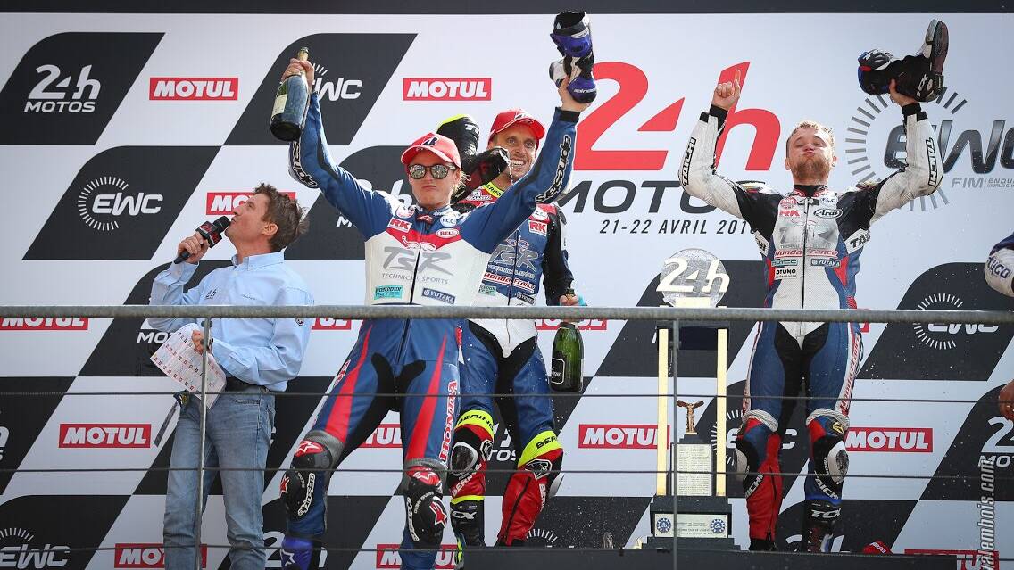 To the winners the spoils: Josh Hook and team-mates celebrate the win at Le Mans.