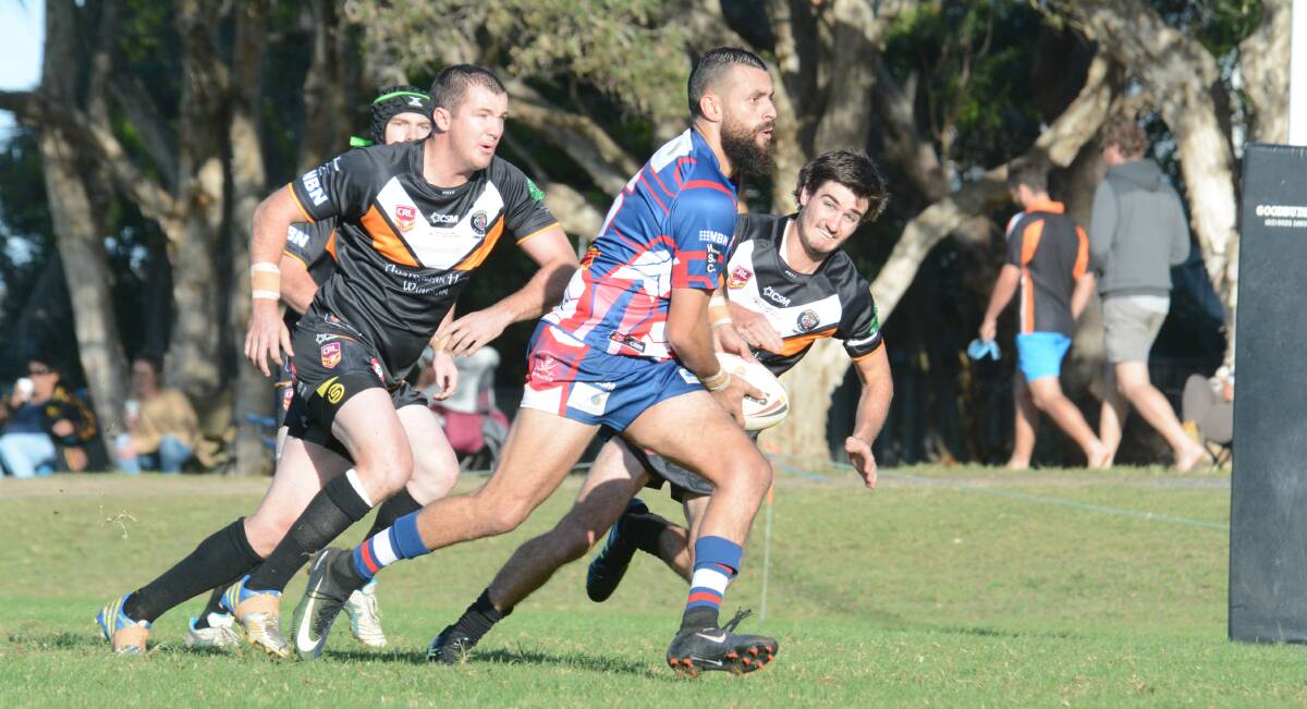 Old Bar five-eighth Nathan Maher tests the Wingham defence during the Group Three Rugby League game at Old Bar. Maher showed touches of class in the 28-18 win over the Tigers.