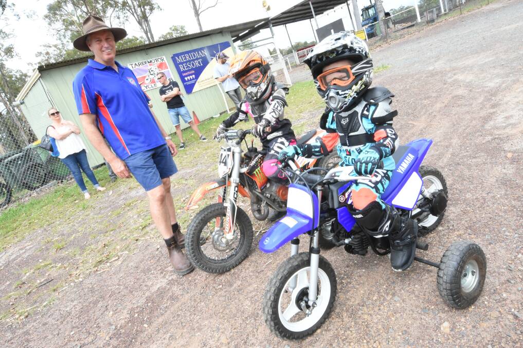 Taree Motorcycle Club's Craig Nelson with young riders Sophie Tuck and Noah Hayes.